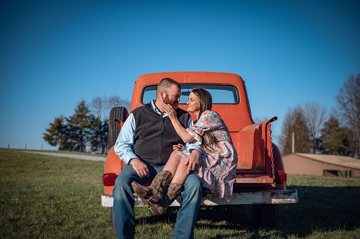 A collection of engagement photos featuring a vintage red pickup truck in a rustic outdoor setting.