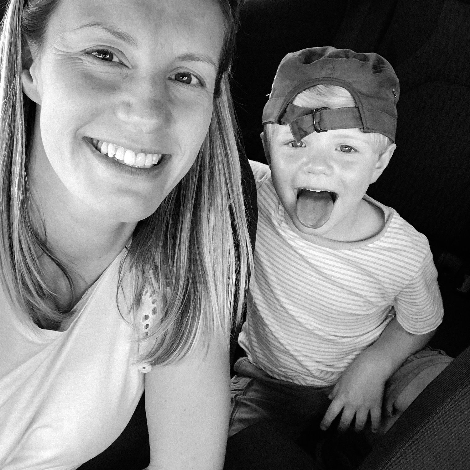 black and white selfie of Kathryn and Theo smiling at the camera.
