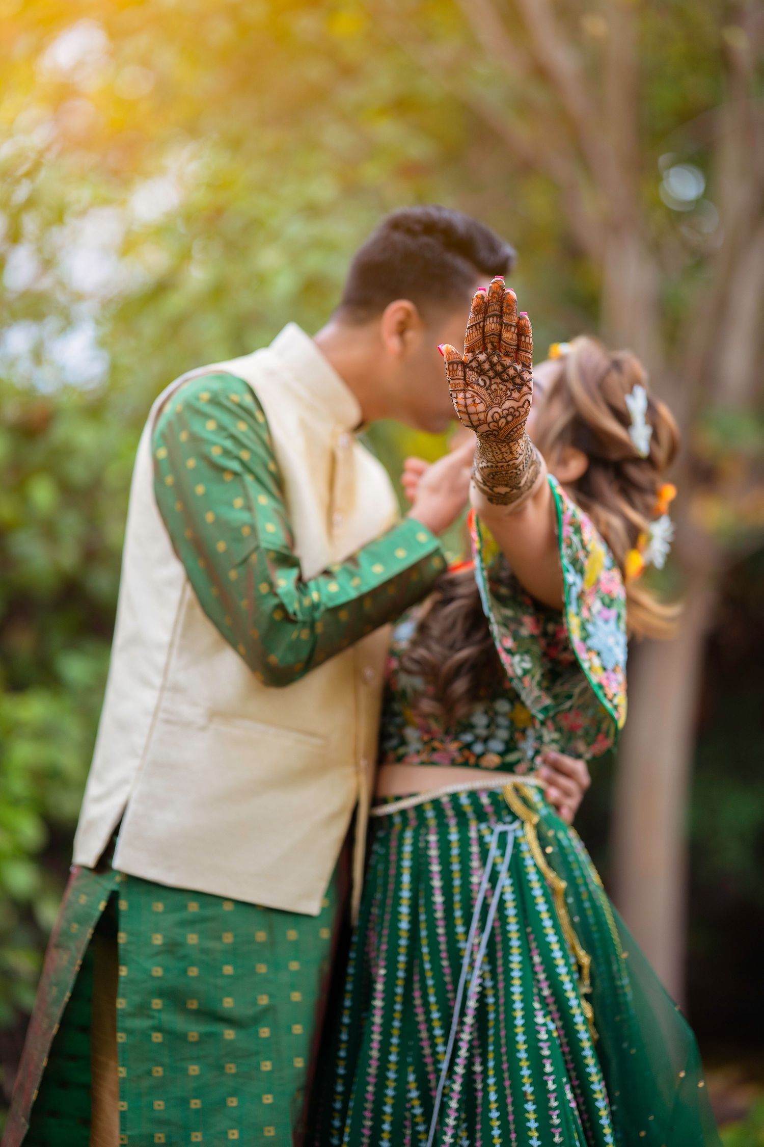 Close-up of intricate henna designs during traditional Indian wedding photoshoot.