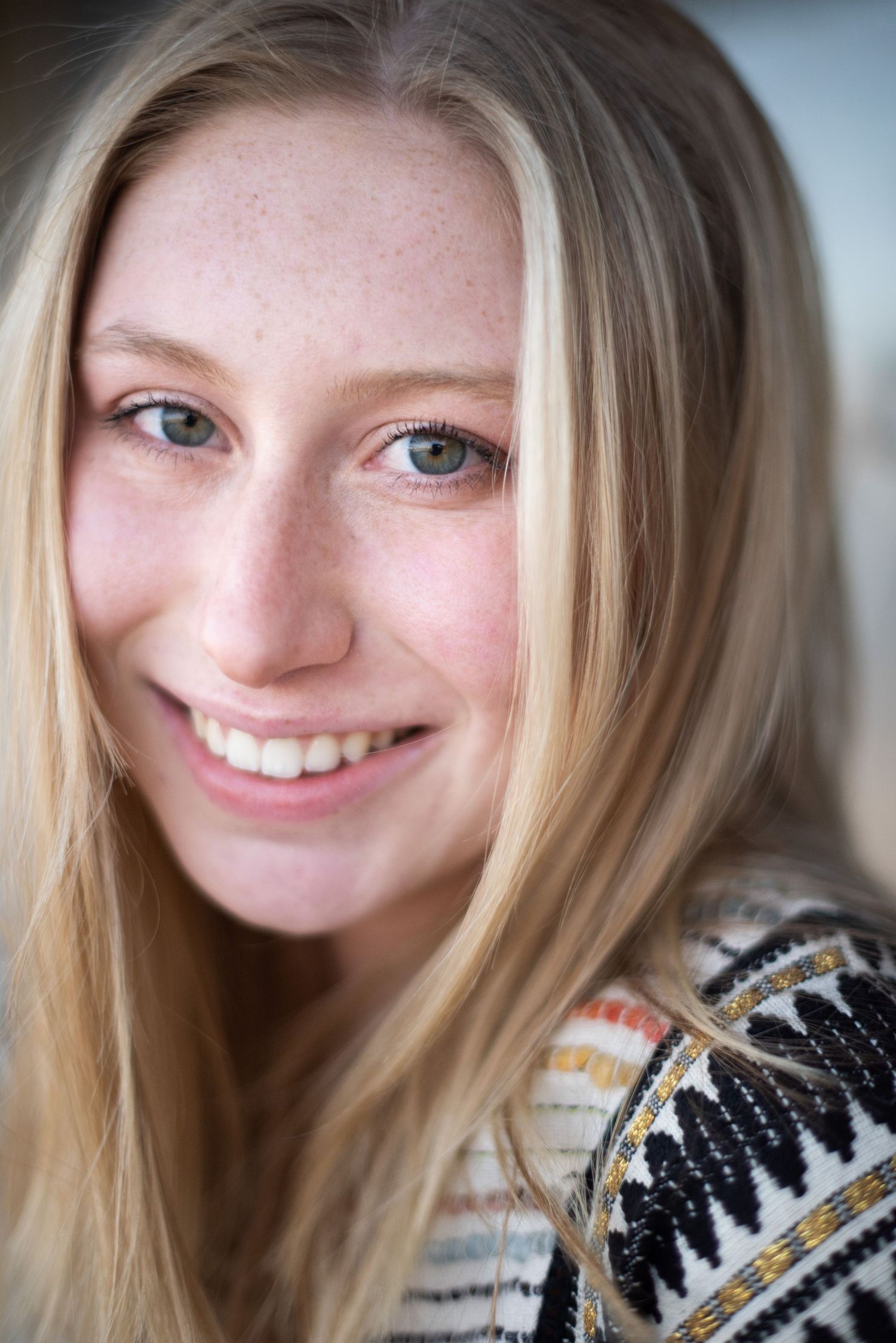 Natural beauty portrait with bright friendly smile and sparkling blue eyes.