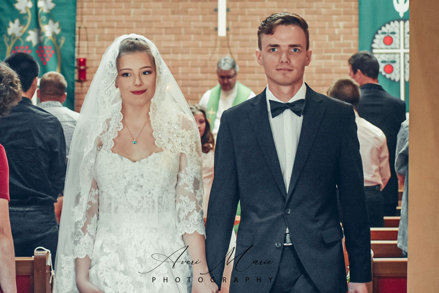 Elegant church wedding ceremony with couple in formal attire.
