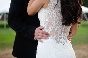 Bride and groom wedding dress details