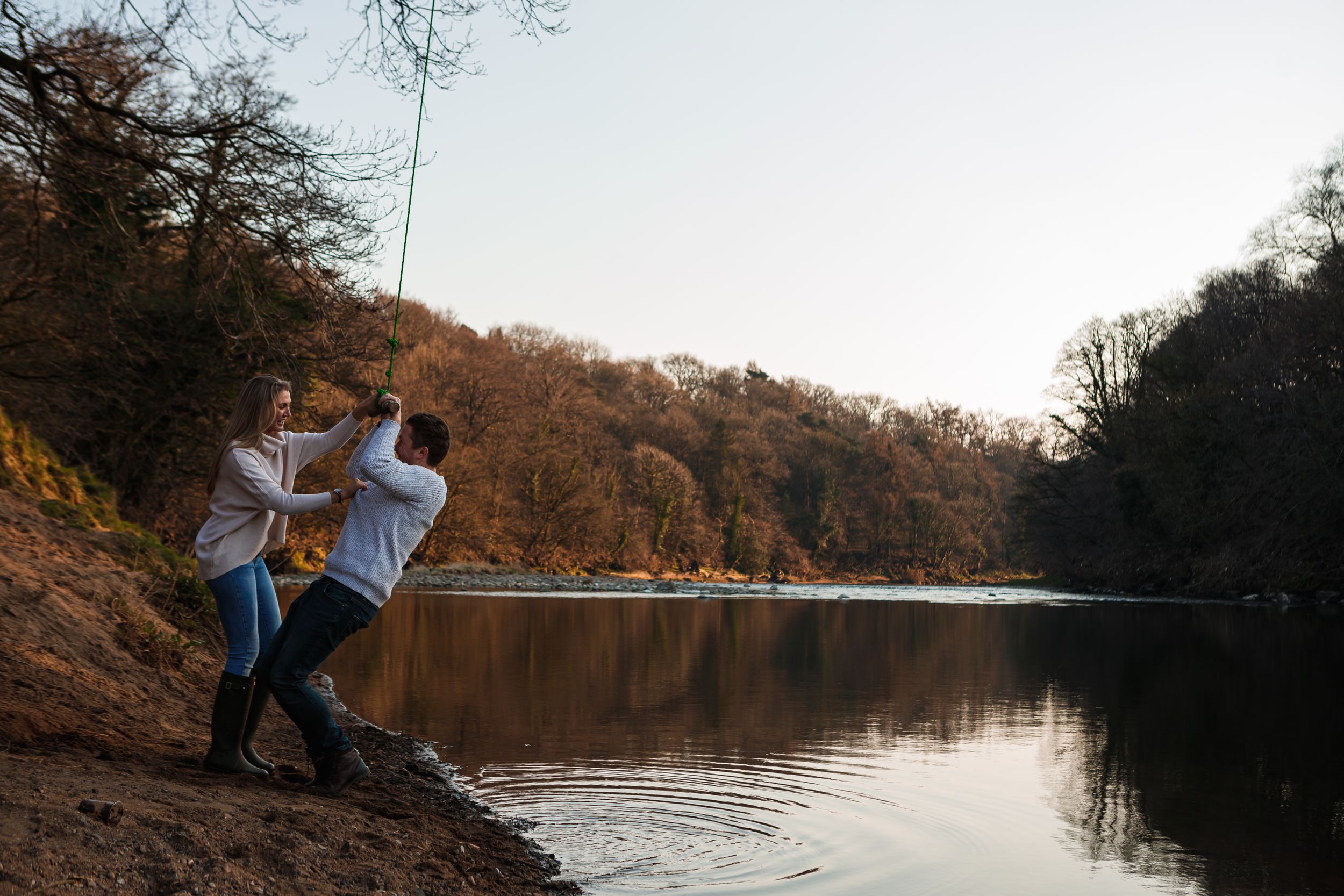 "couple on swing engagement shoot"