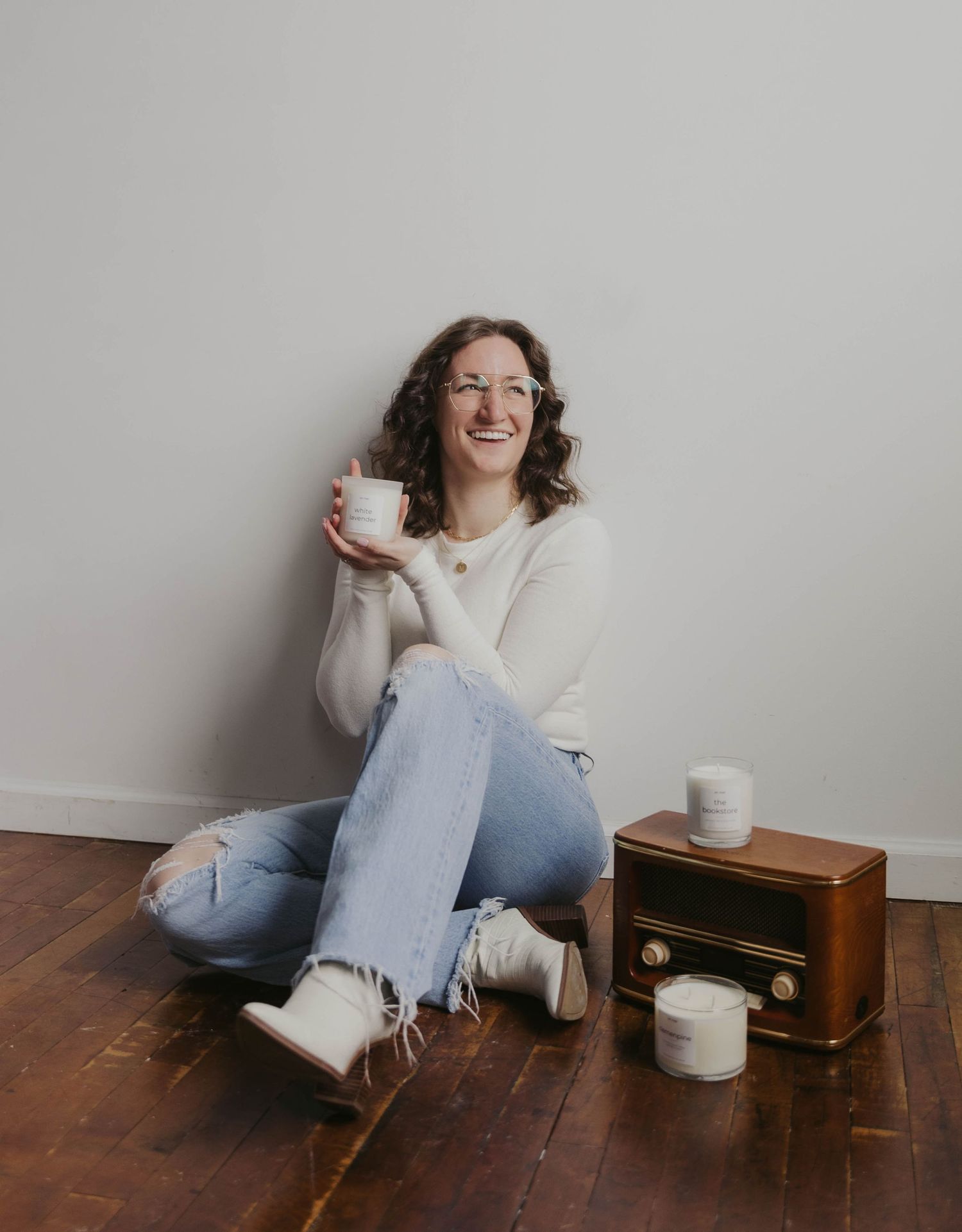 Casual lifestyle portrait with vintage radio and coffee cups on wooden floor.