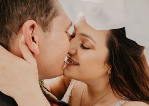 Husband and Wife almost kiss on wedding day