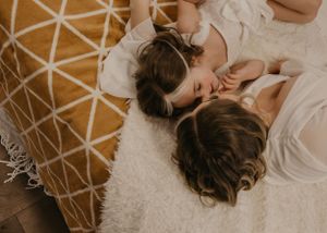 mother and daughter embrace during mommy and me photoshoot