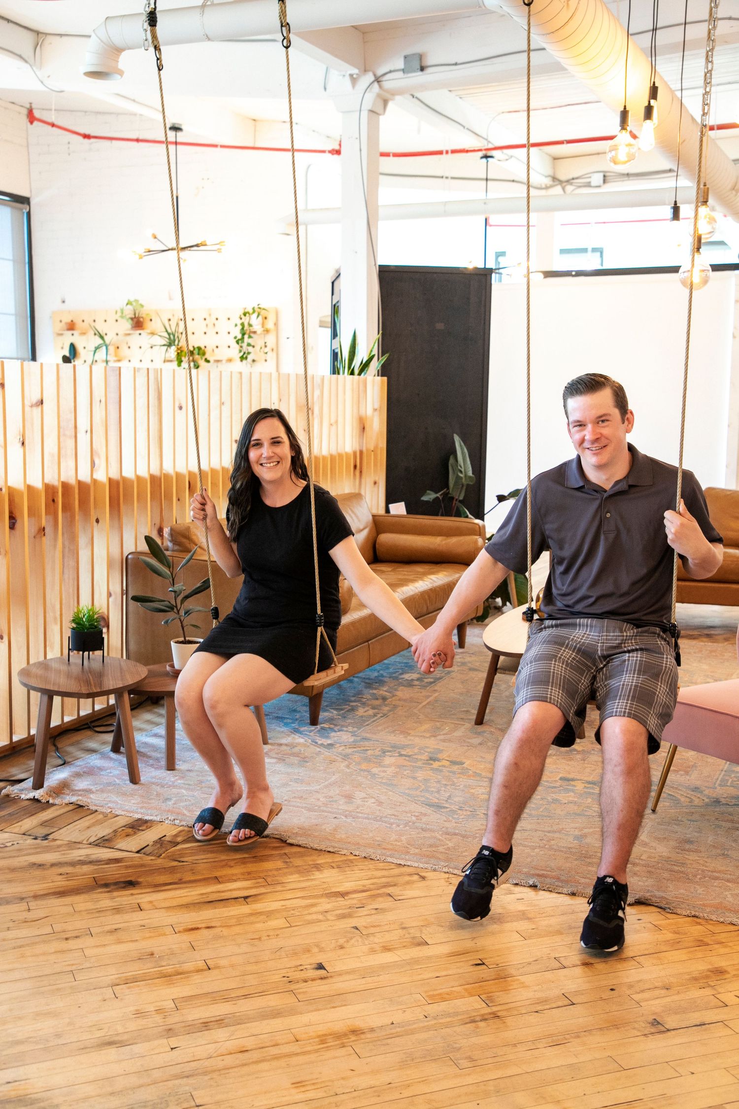 The Park coworking studio, with a couple holding hands on the swings