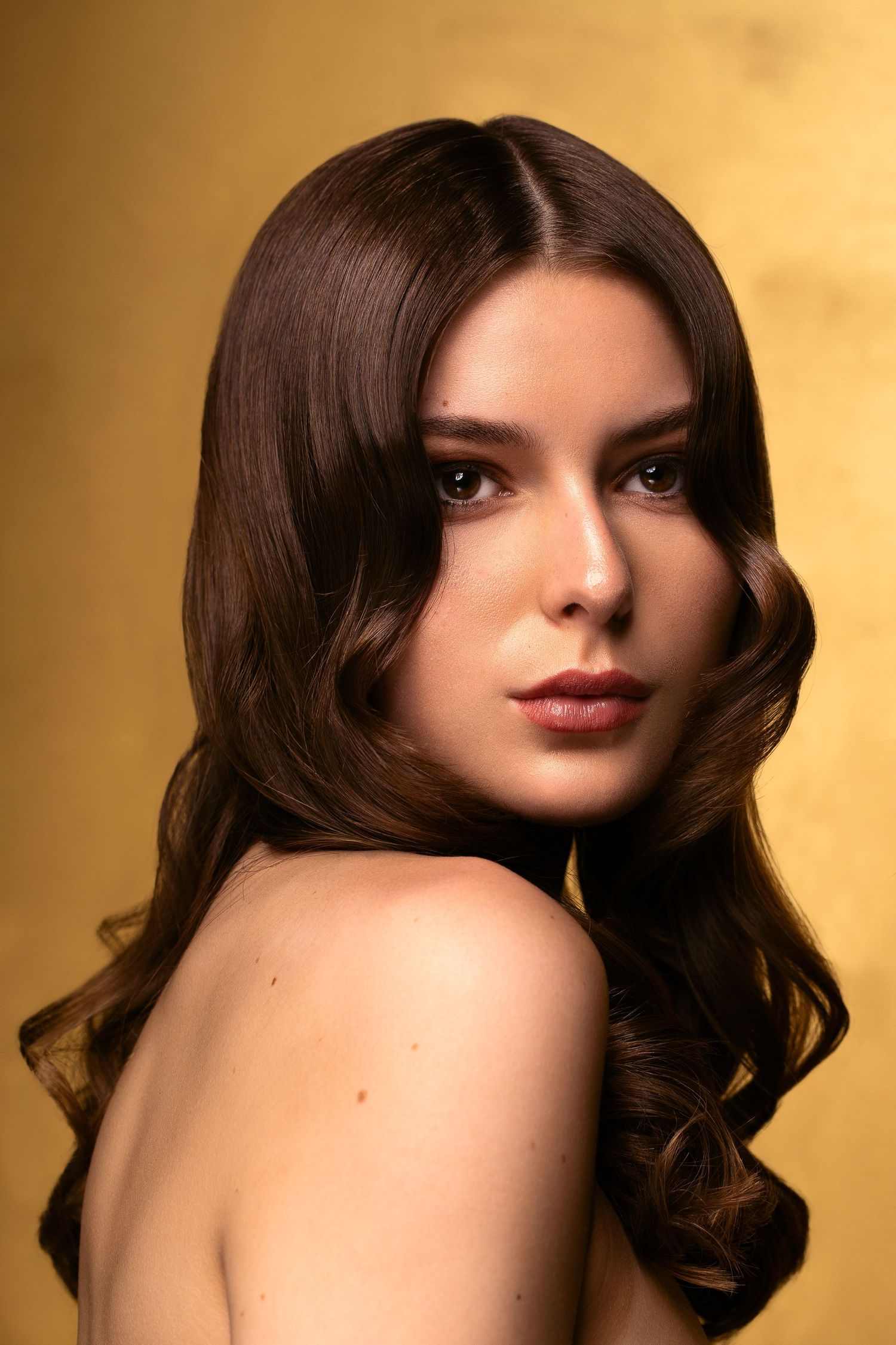 Beauty head shot with a gold theme.