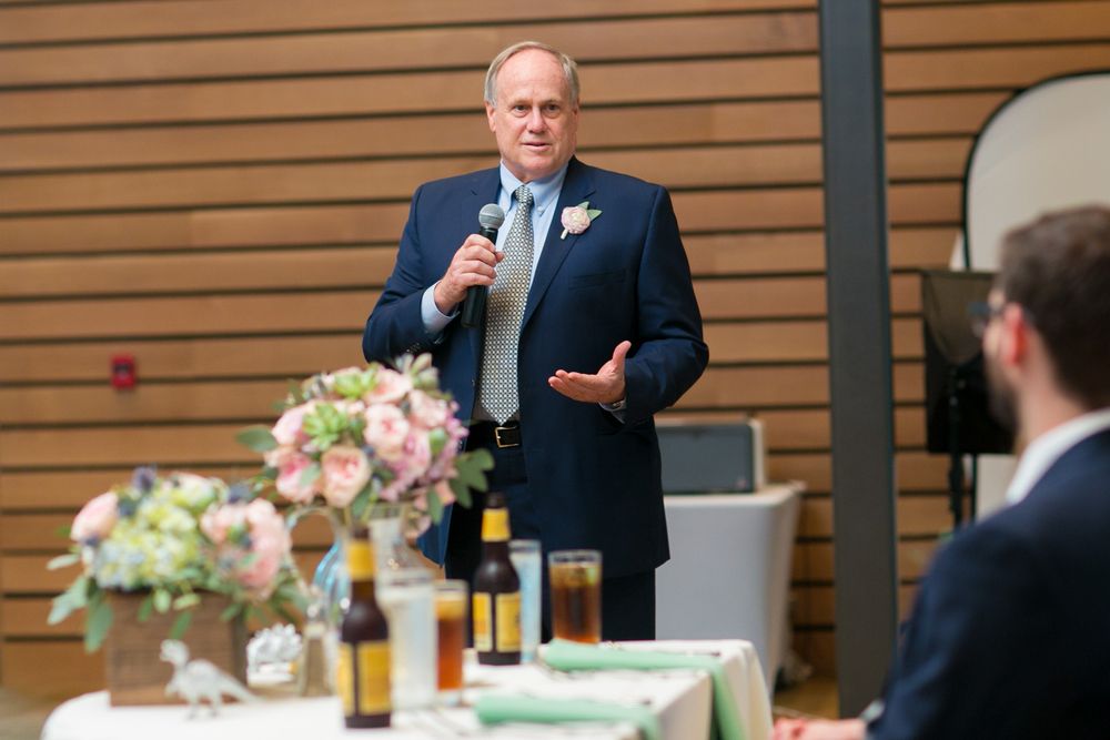Best man giving a wedding toast at reception