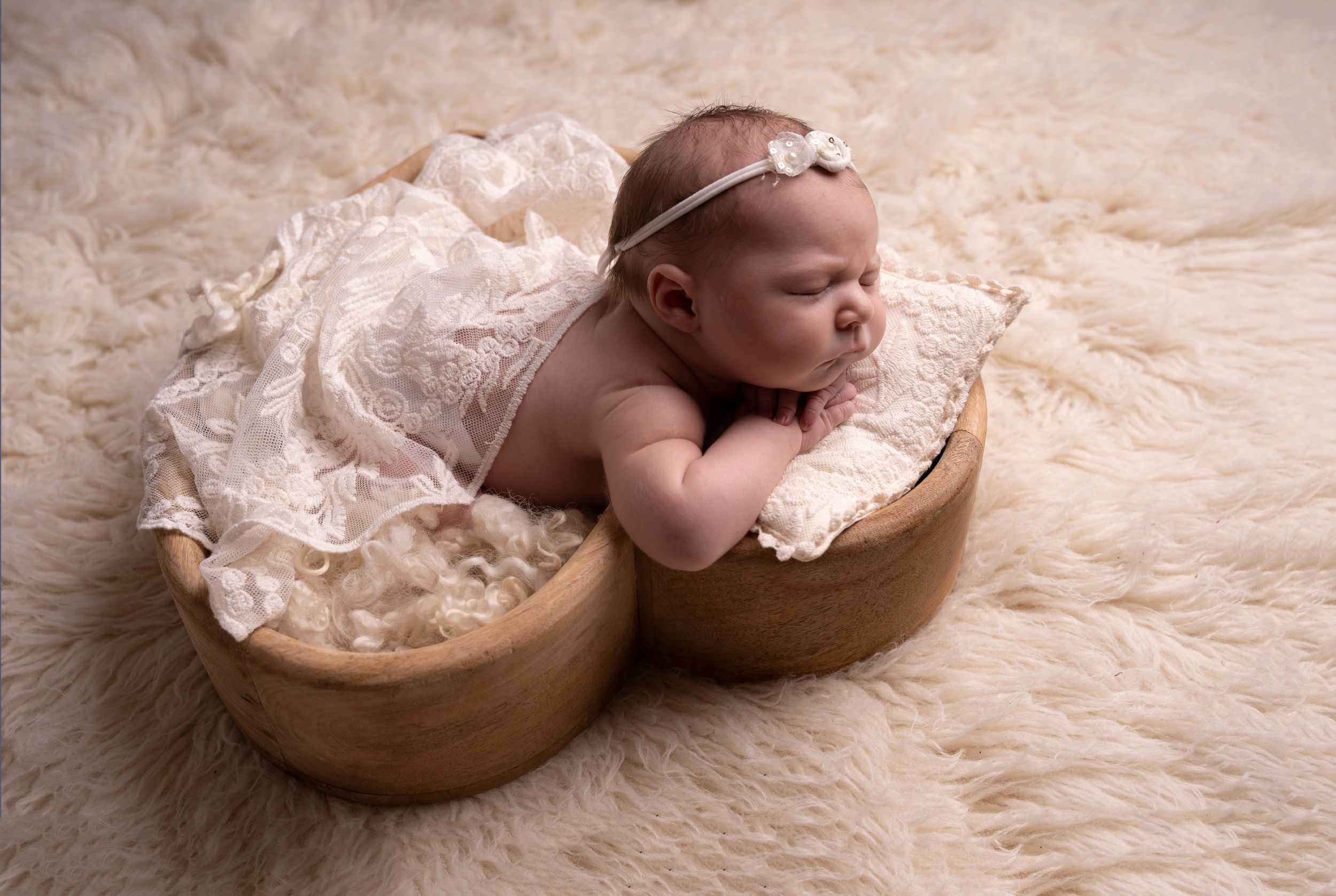 simple posed on baby's hand in heart prop and wrapped with fine texture