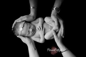 posed in parents hands