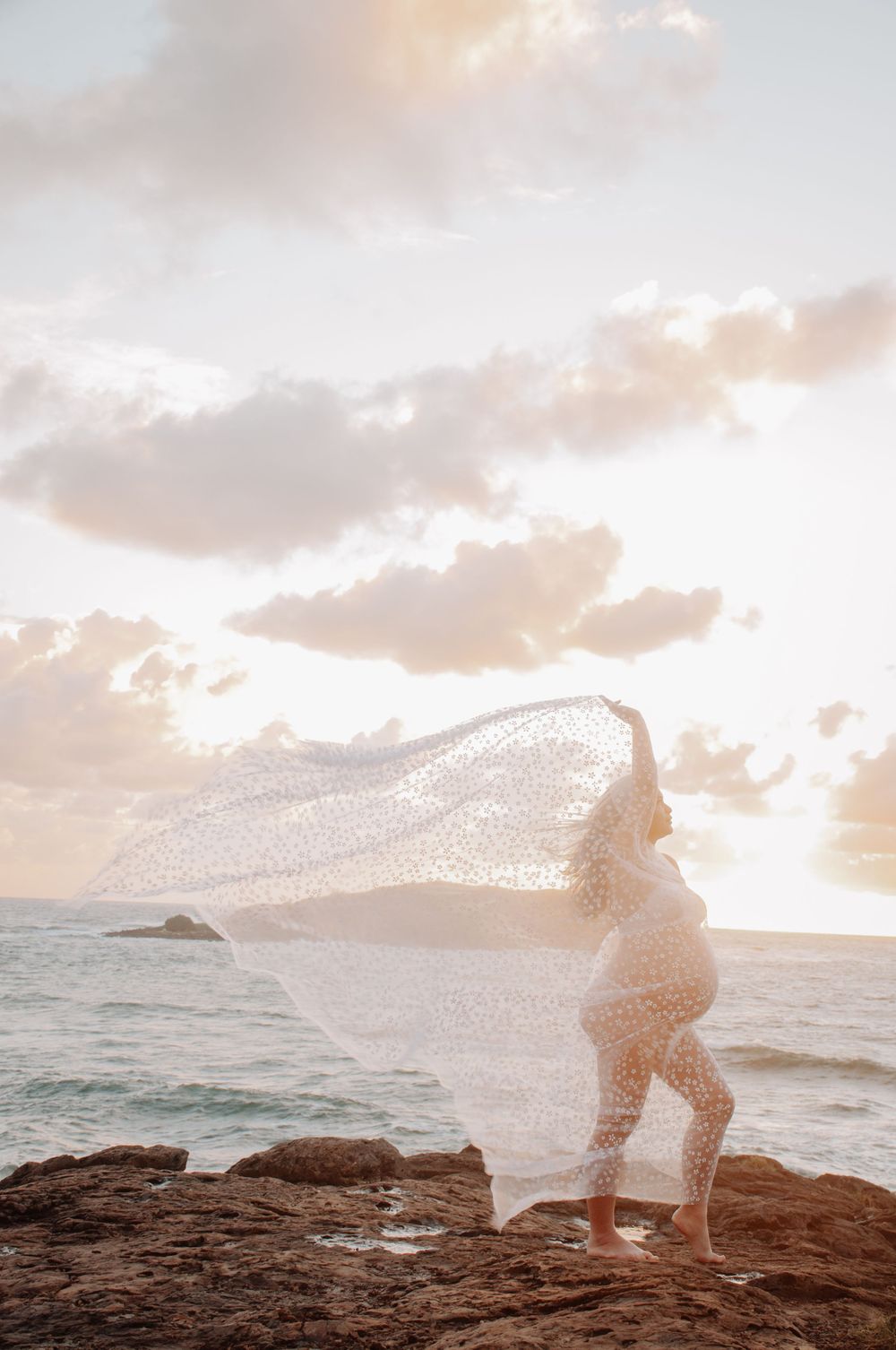 maternity session on the rocks at the beach