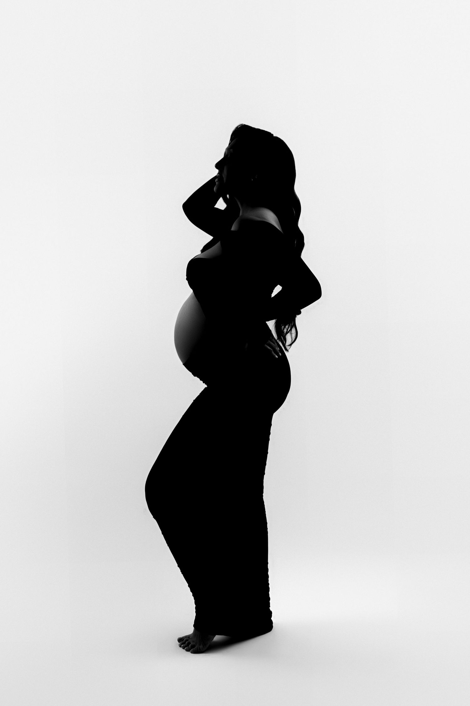 Series of silhouette maternity portraits against white background showing pregnancy progression.