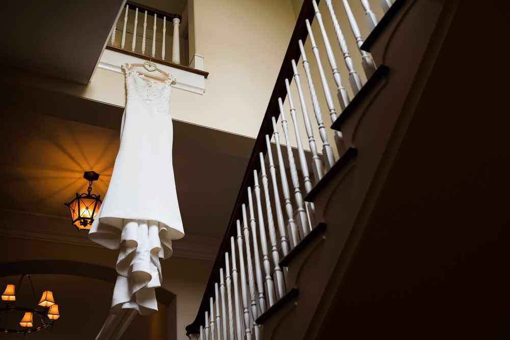 Bride's dress hanging on her wedding day in Akron, Ohio.