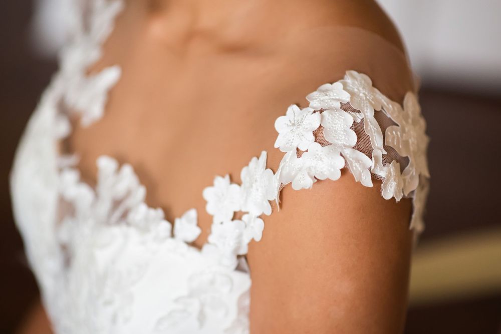 Bride's dress details on wedding day in Akron, Ohio.
