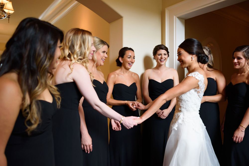 Bride and bridesmaid first look on wedding day in Akron, Ohio.