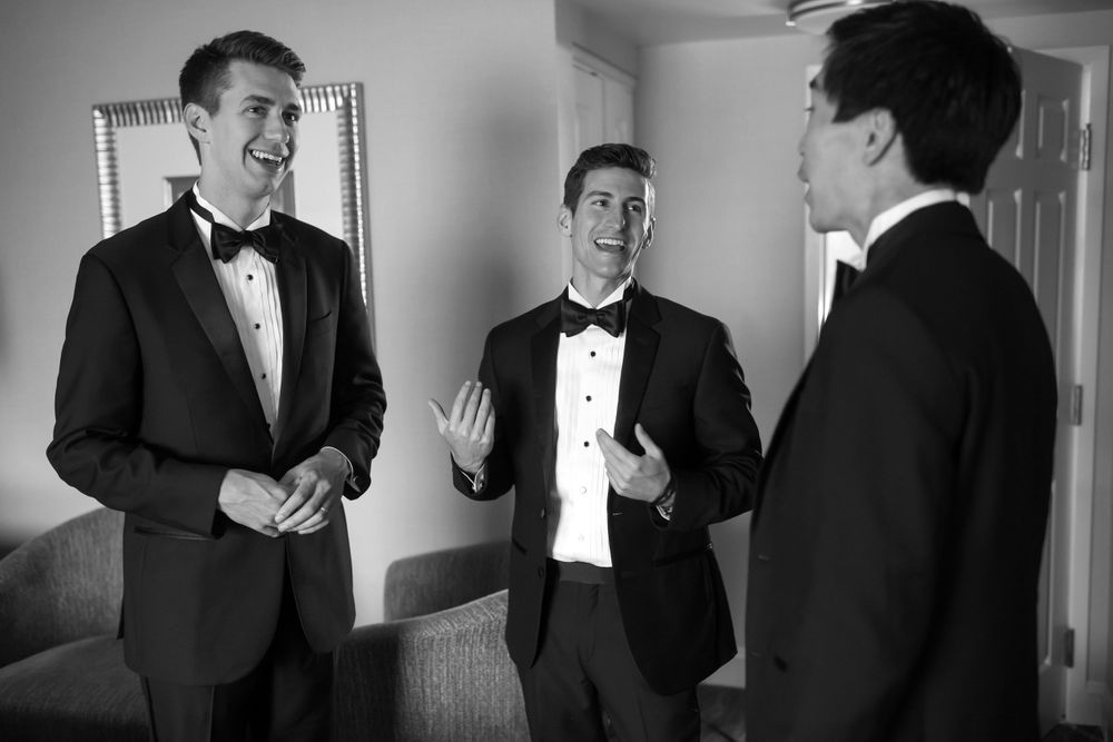 Groomsmen interacting on wedding day in Akron, Ohio.