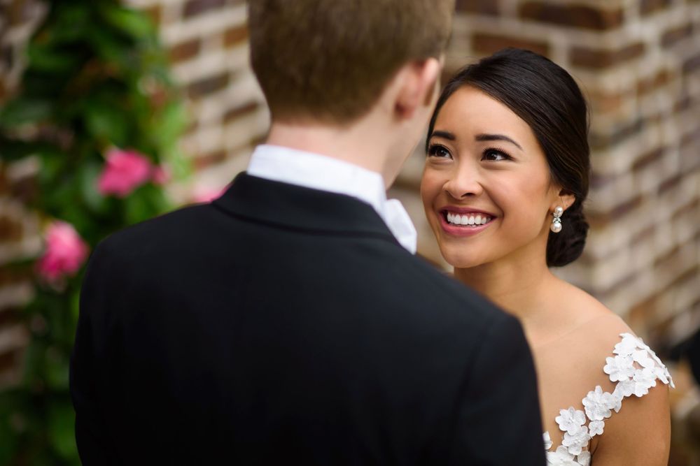 Bride looks into groom's eye on their wedding day in Akron, Ohio.