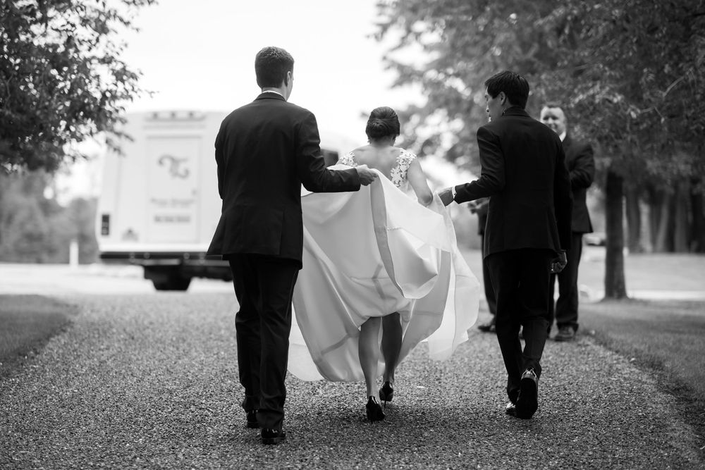 Brother helps bride on her way to wedding ceremony in Akron, Ohio.