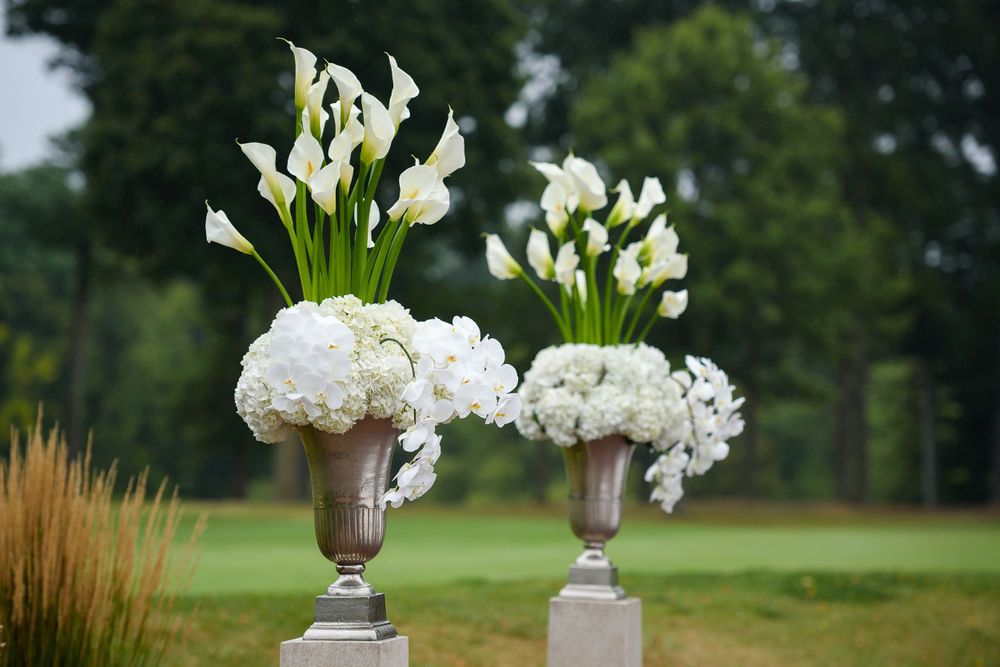 Flower arrangement for outdoor wedding ceremony at Fairlawn Country Club in Akron, Ohio.