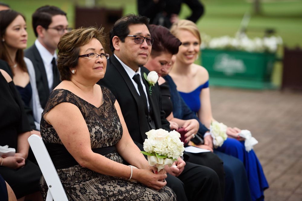 Bride's parents watch outdoor wedding ceremony at Fairlawn Country Club in Akron, Ohio.