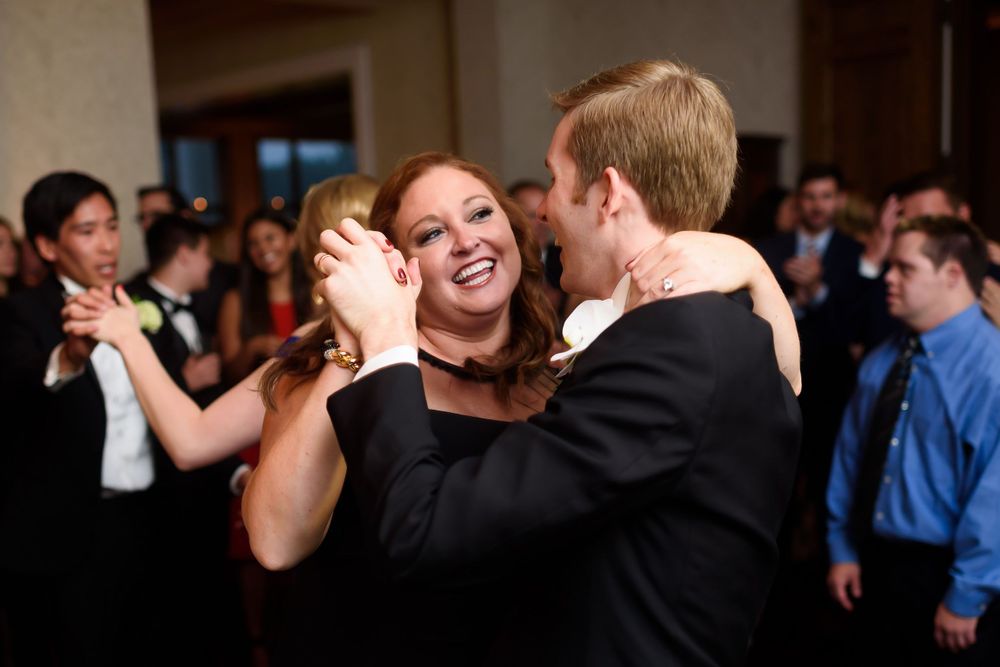 Groom and his sister dancing during wedding reception at Fairlawn Country Club in Akron, Ohio.