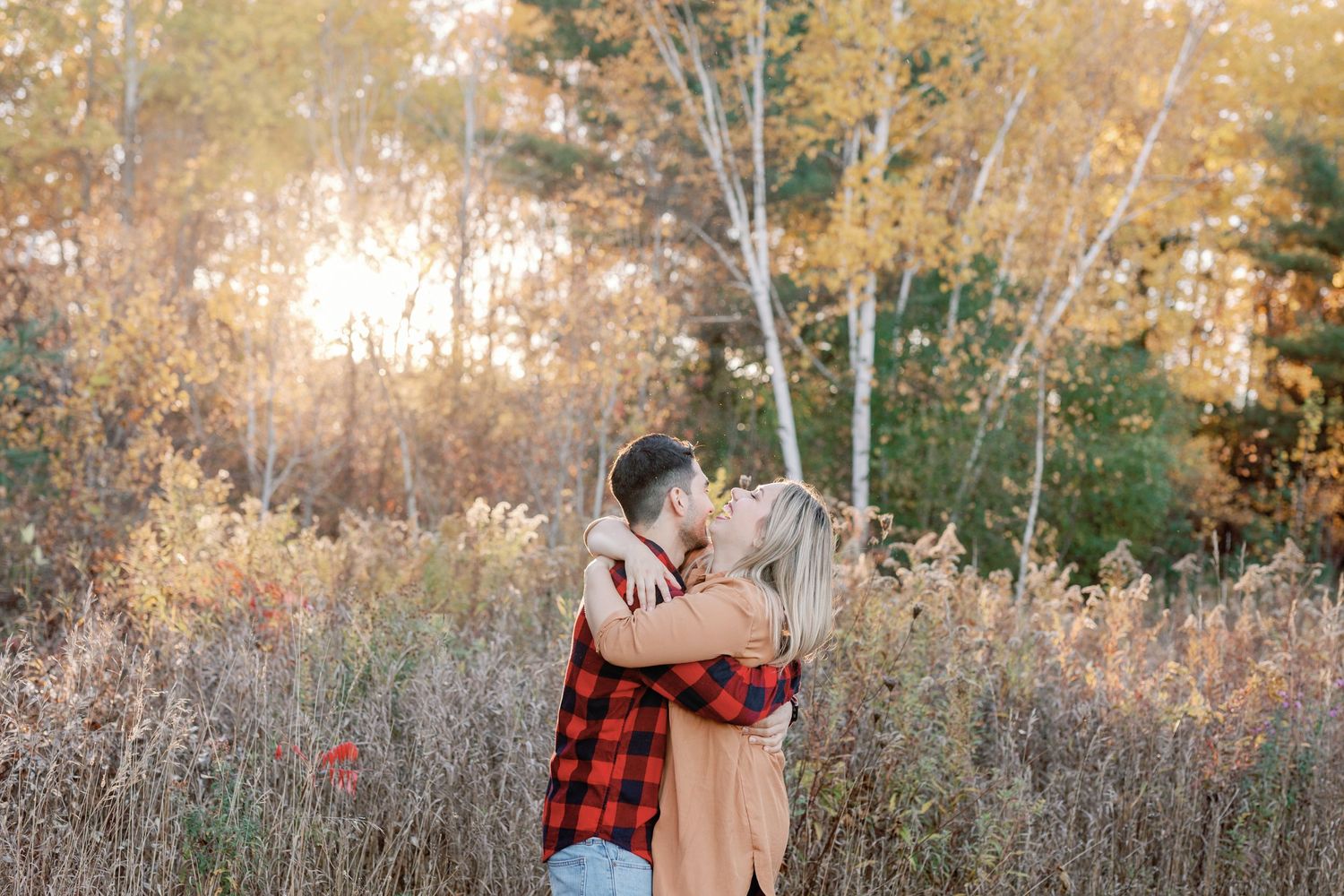 A romantic autumn photoshoot with golden leaves and natural lighting.