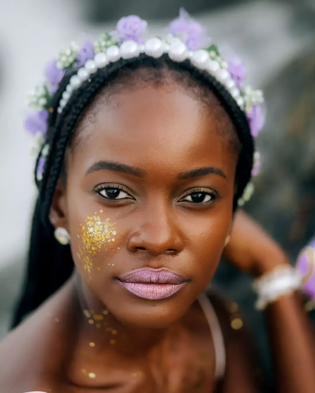 Bride in elegant dress by turquoise water