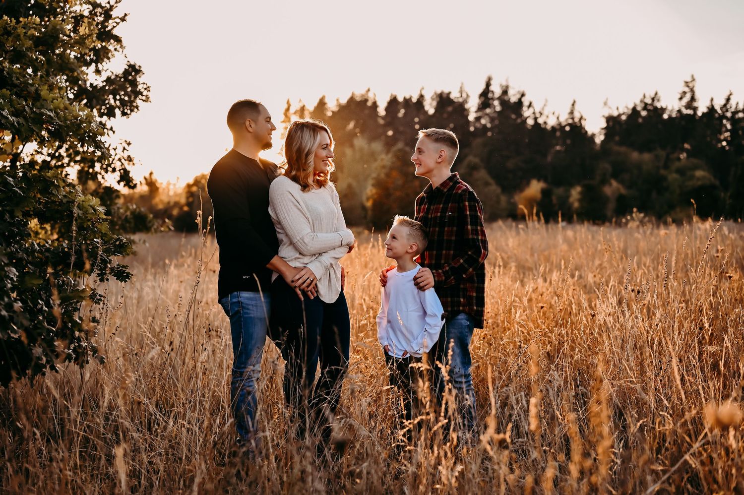Family stands in a field