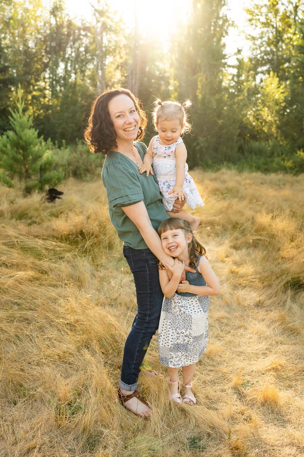 Mother with her daughters, backlit in Kirkland.