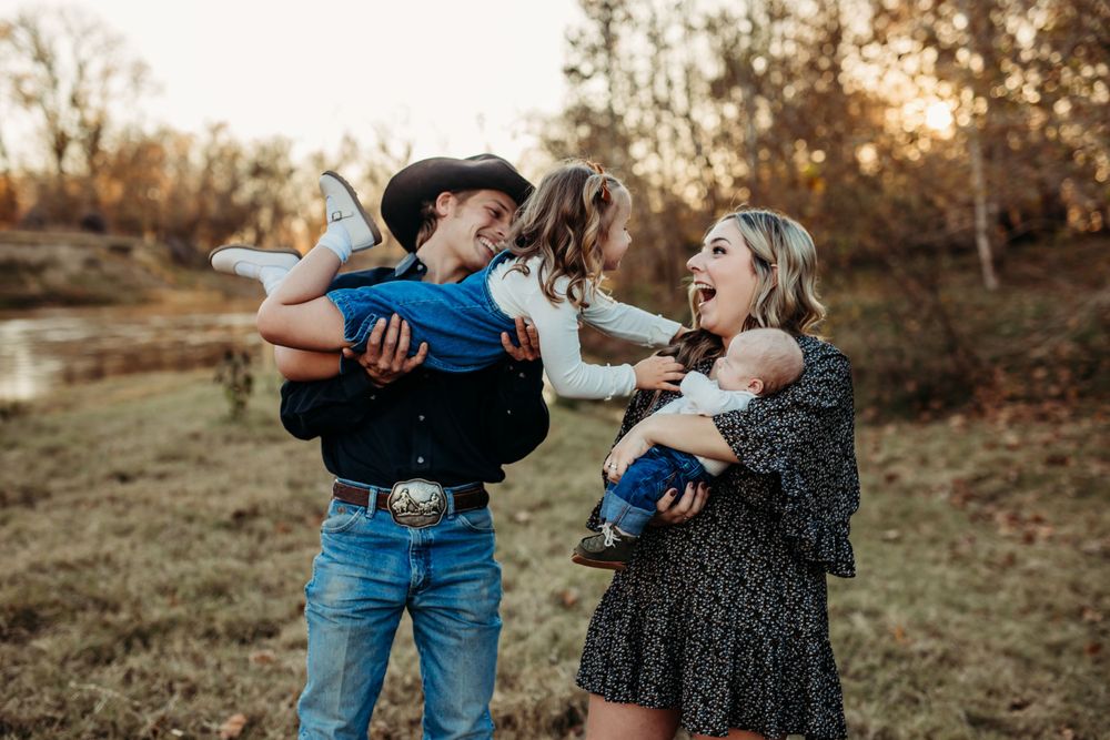 Family of 4 playing at golden hour