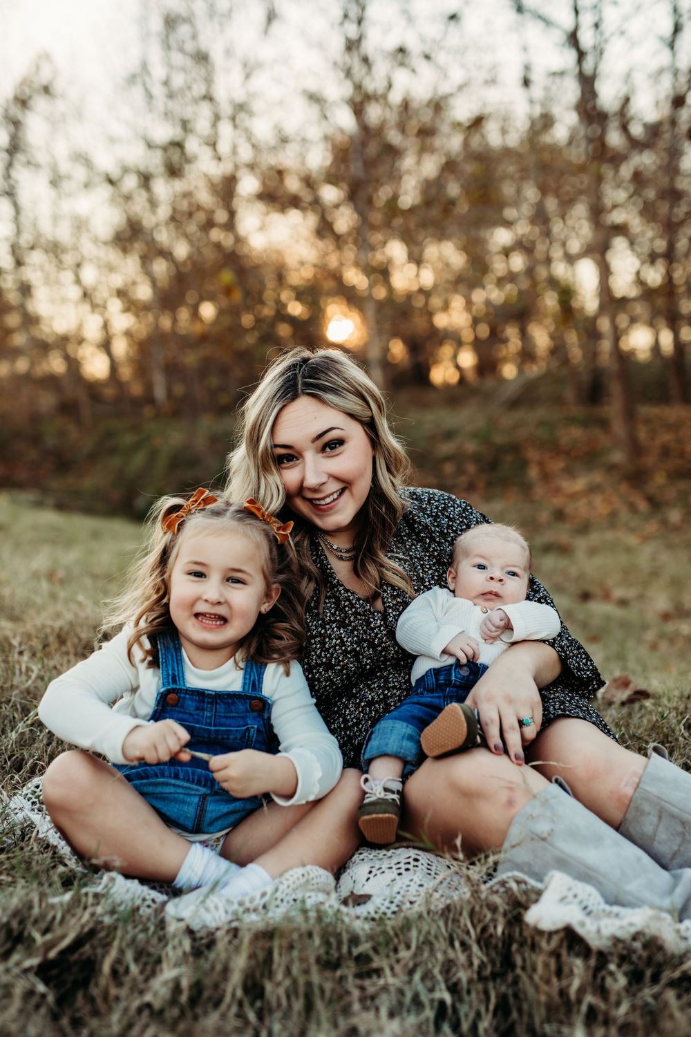 mom cuddling her two kids