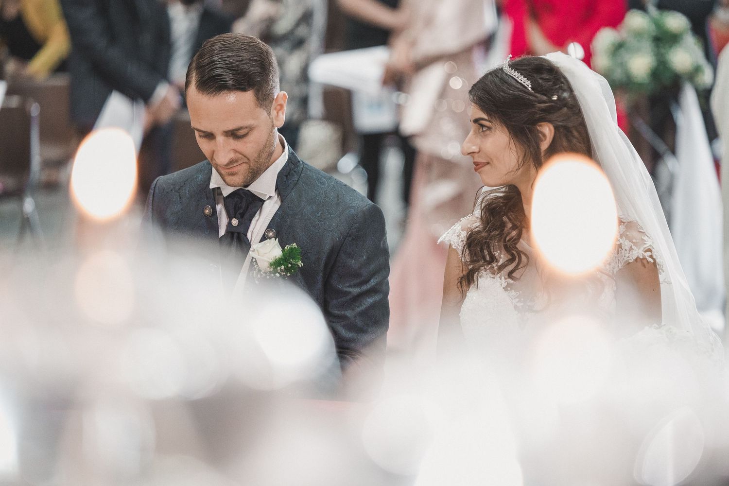 Elegant wedding ceremony moments captured in soft focus with joyful expressions.
