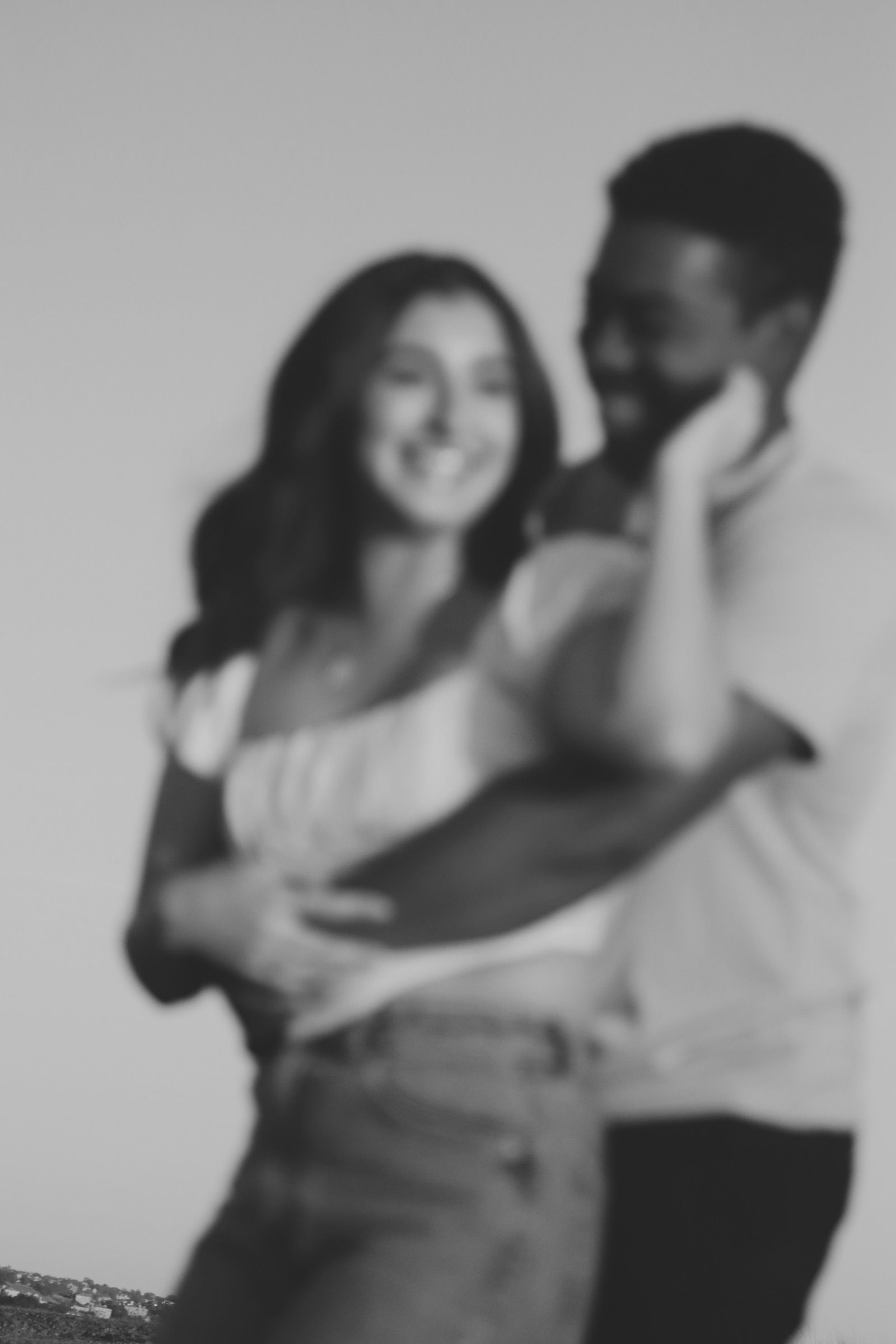 Cinematic blurry photo of engaged couple