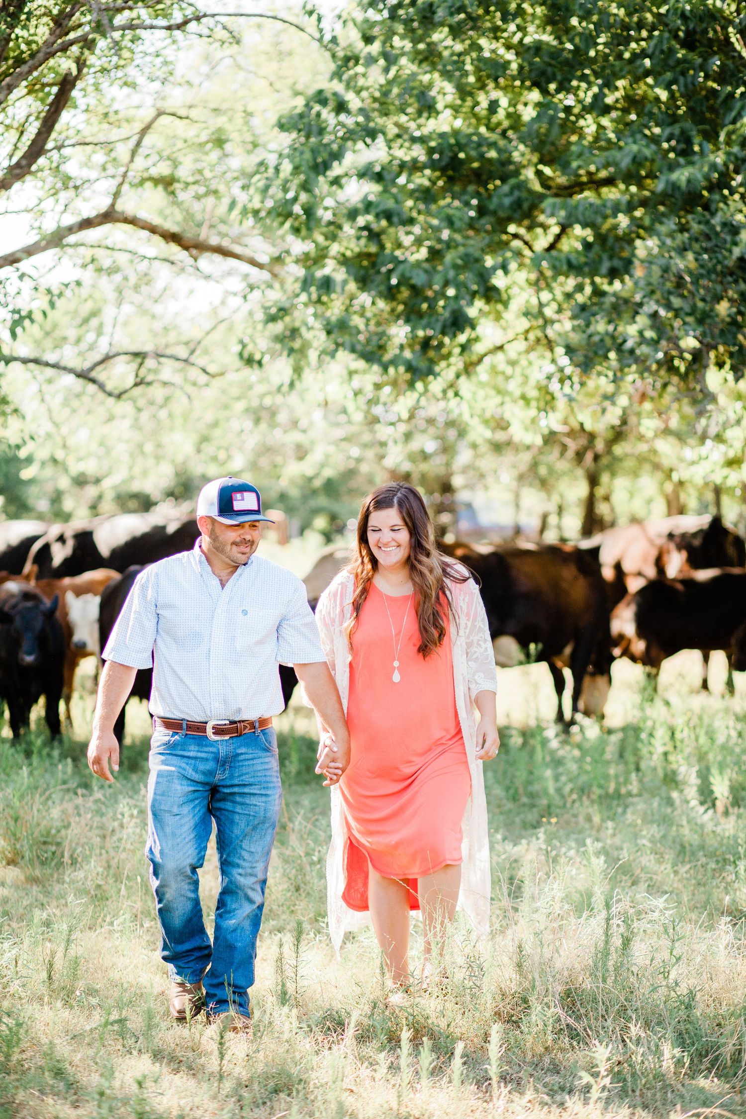 couple with cattle ranch photo