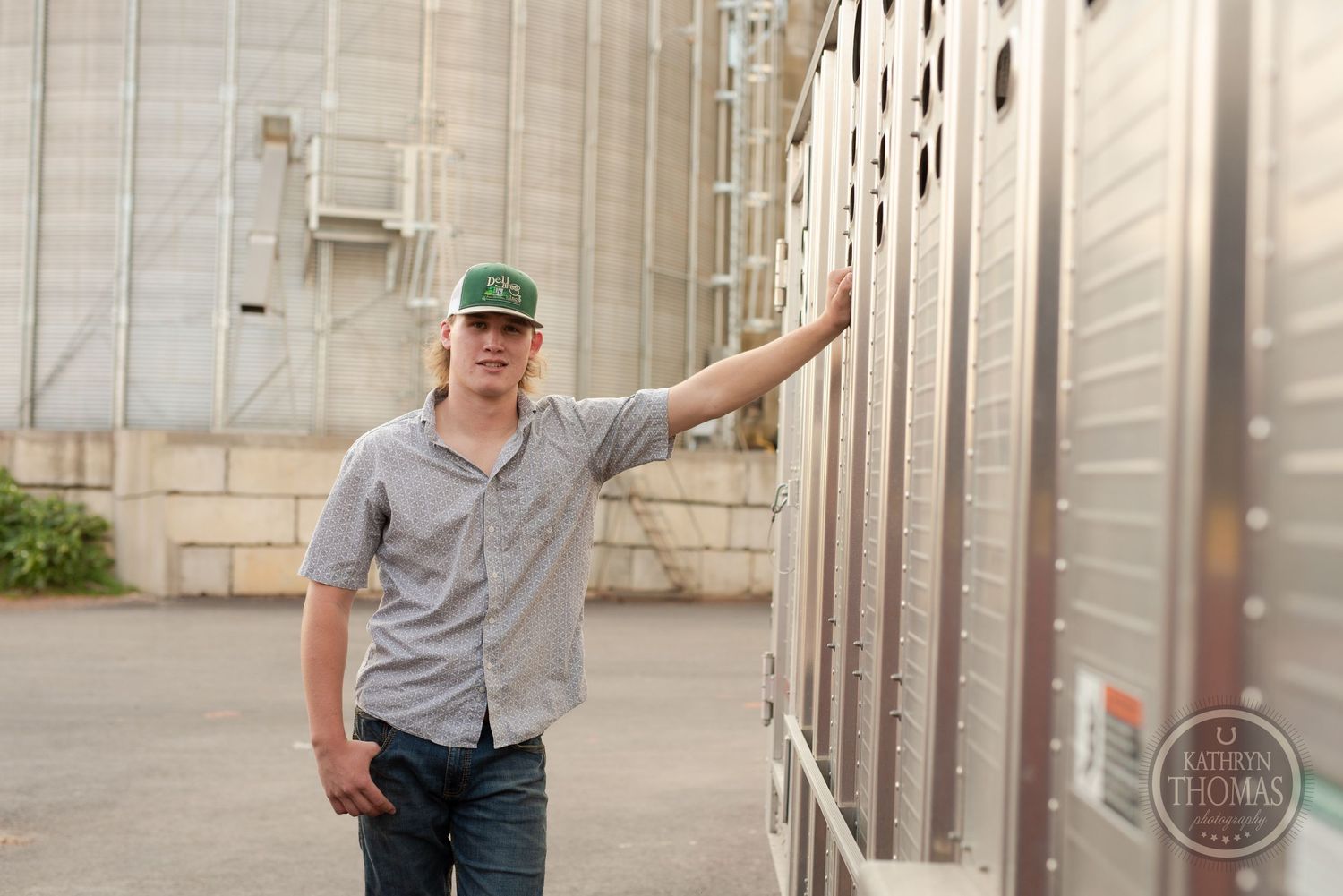 Industrial agricultural setting with grain storage facilities and metal structures.