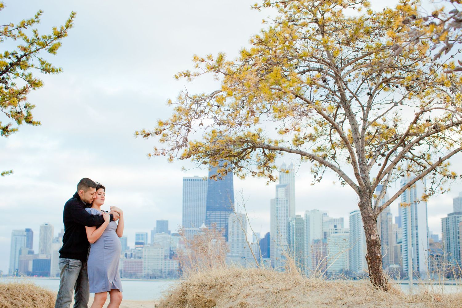 Romantic photo series with city skyline and autumn trees in the background.