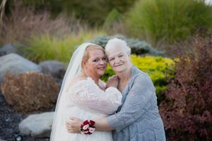 Wedding portraits taken in a beautiful outdoor garden setting with natural landscaping.