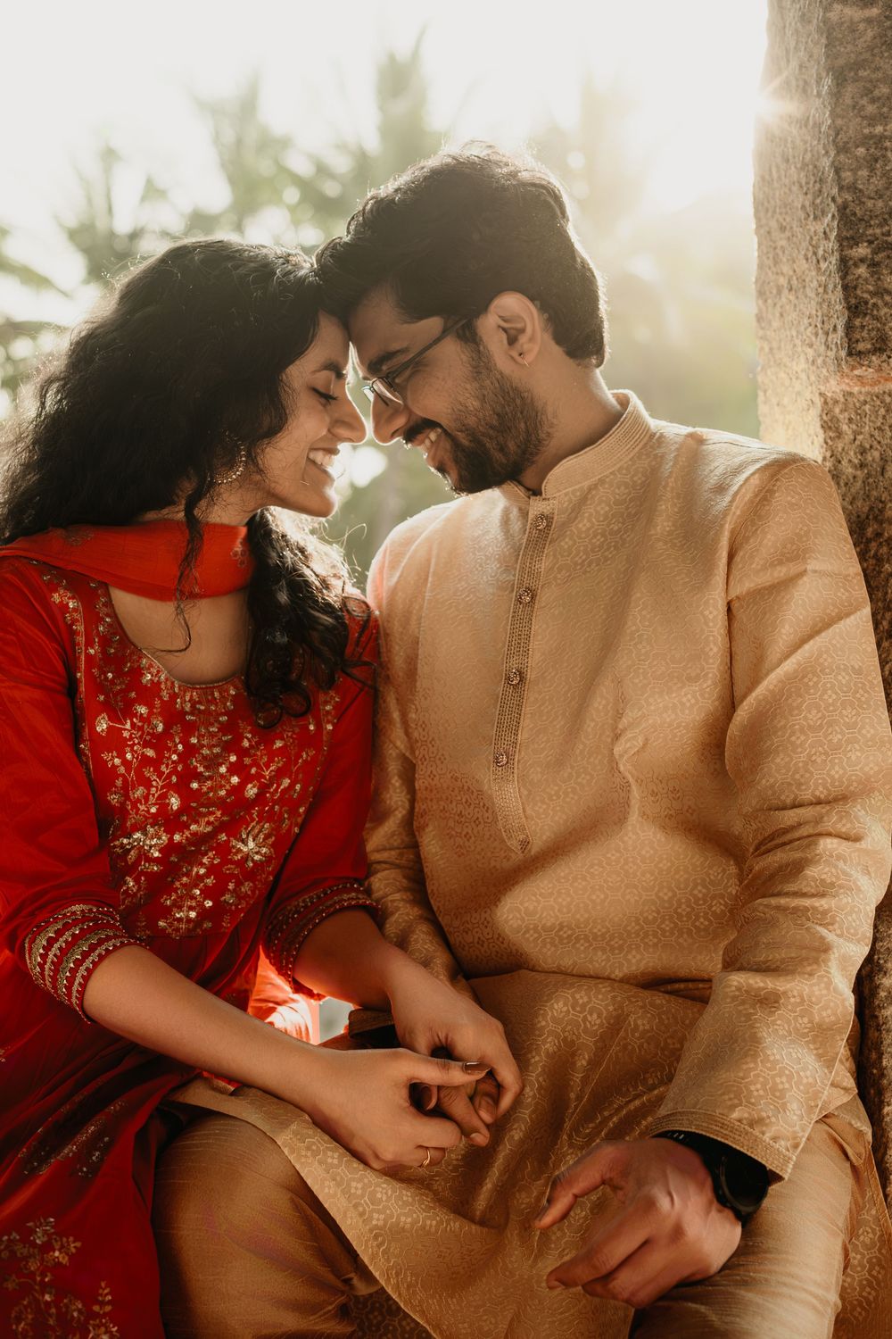 Romantic couple in traditional Indian attire sharing intimate moments in a series of warm sunlit photographs.