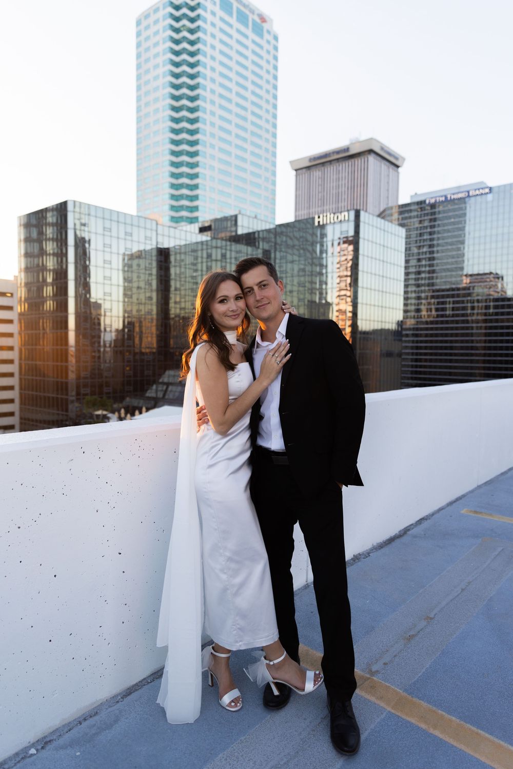 Orlando luxury wedding photographer bride and groom on top of a rooftop parking garage for the beautiful backdrop.
