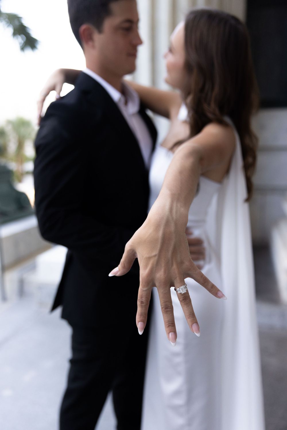 Orlando luxury wedding photographer showing off the amazing engagement ring.