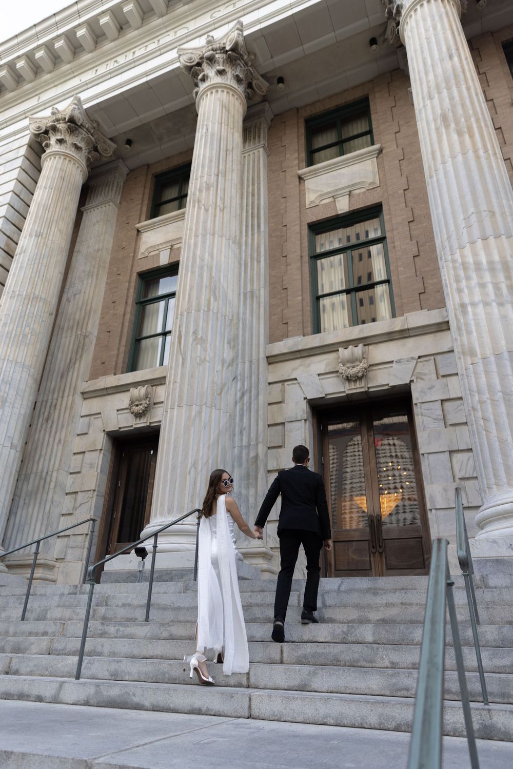 Orlando luxury wedding photographer capturing bride and groom at their local courthouse.