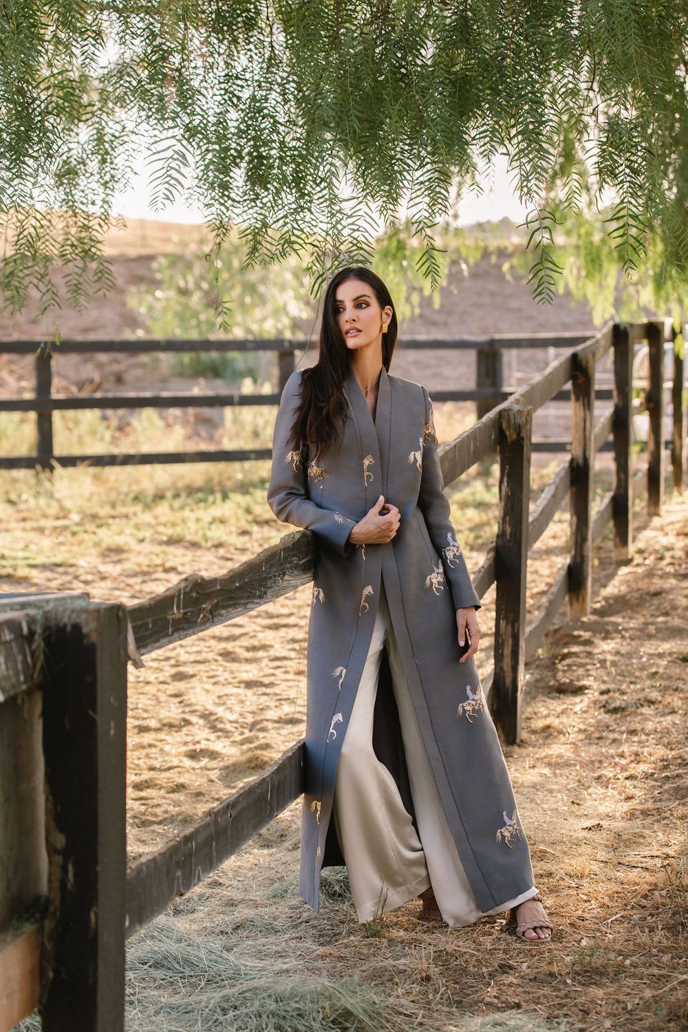 High-fashion editorial with layered textures and neutral tones.