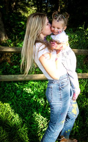 A tender moment captured between mom and daughter.