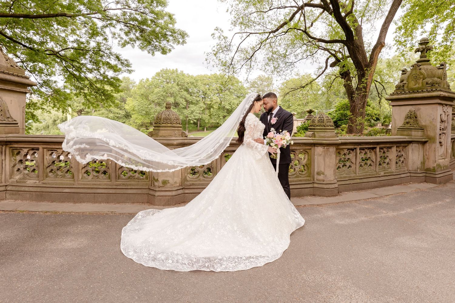 Black and white reception dance with elegant decor and floral arrangements.