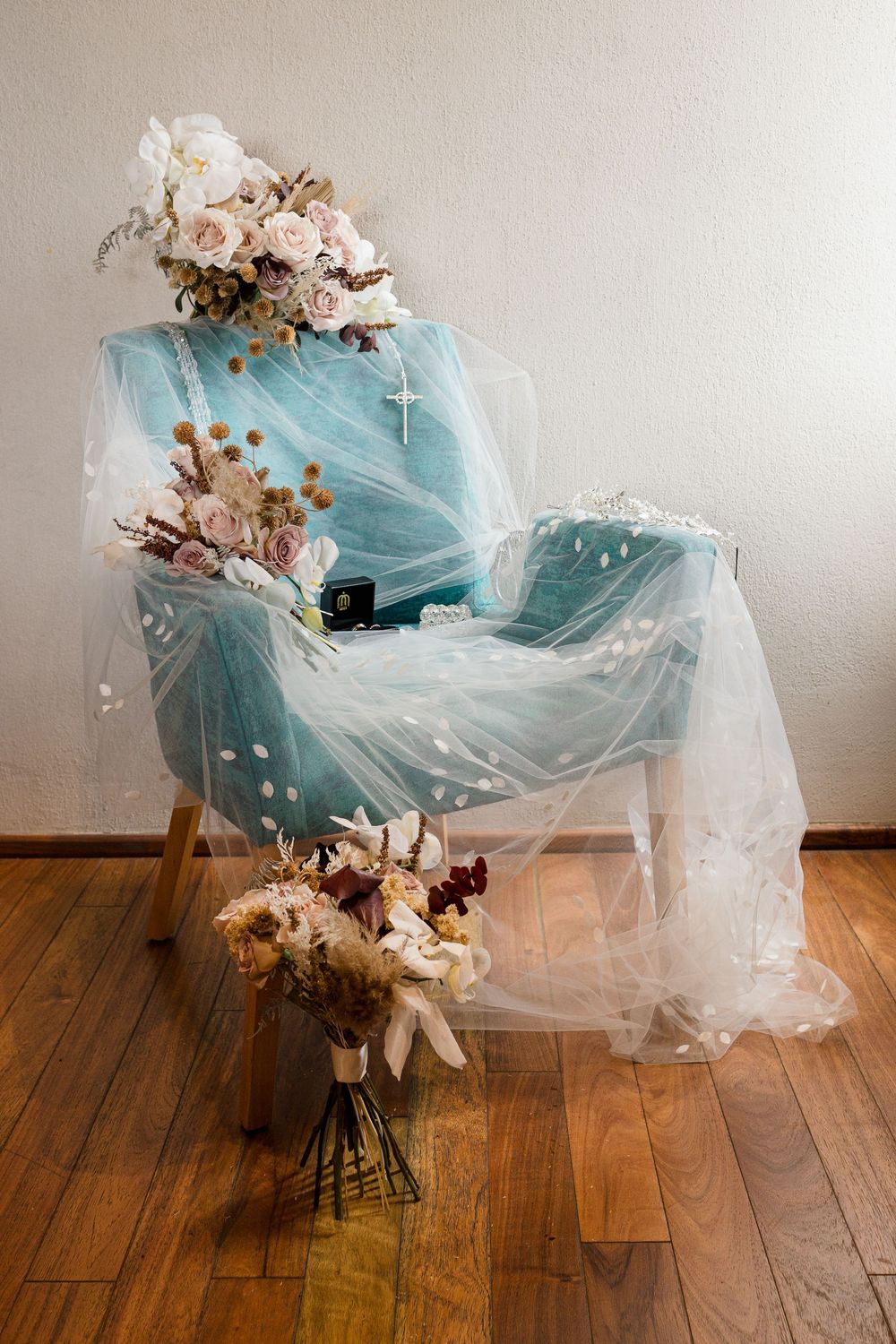 A sequence of photos showing a blue tulle fabric draped over a chair with scattered dried flowers and petals.