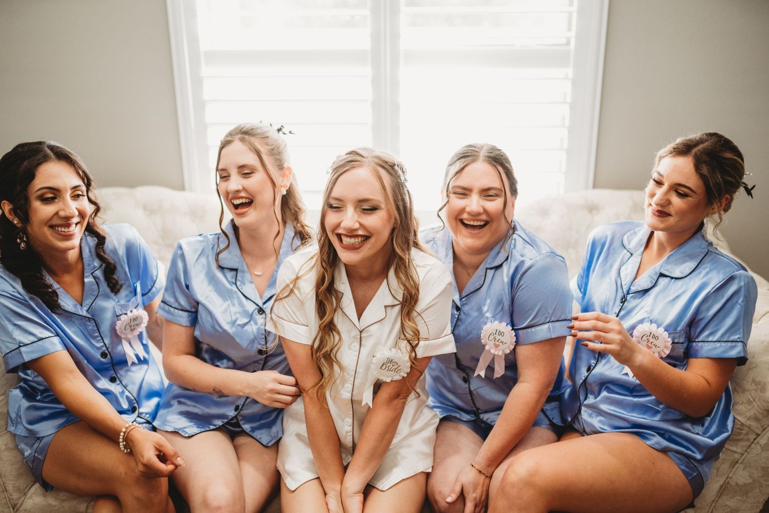Getting ready scene with matching blue robes and joyful moments.