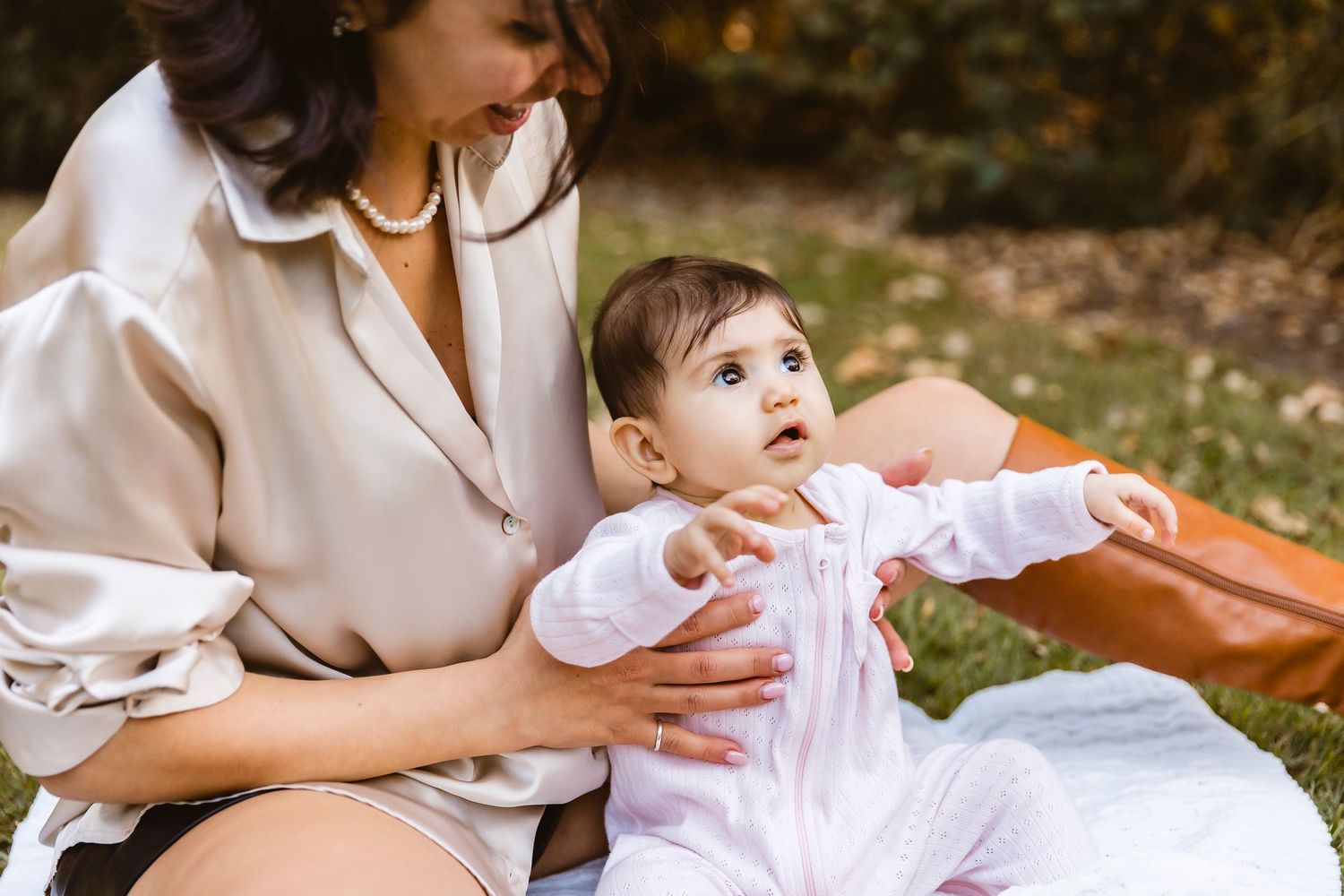 Mum and baby looking at creek during family photo shoot at Mt Coot-tha Slaughter Falls