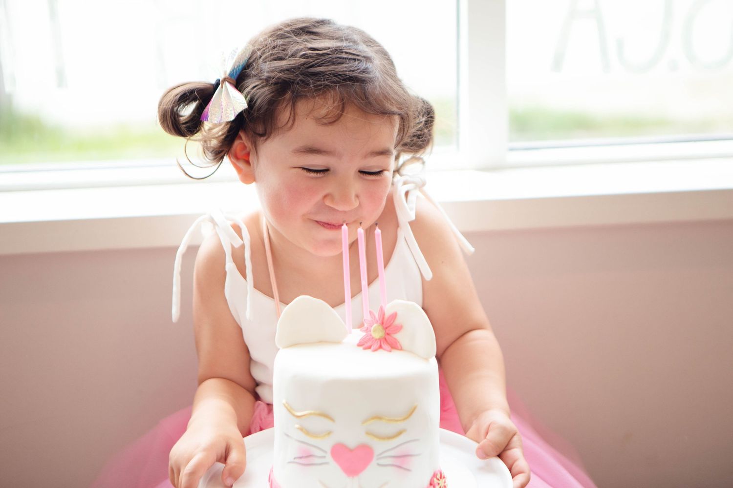Surrey BC Vancouver Event Photographer mom and daughter birthday party Location Performing Star blowing out candels