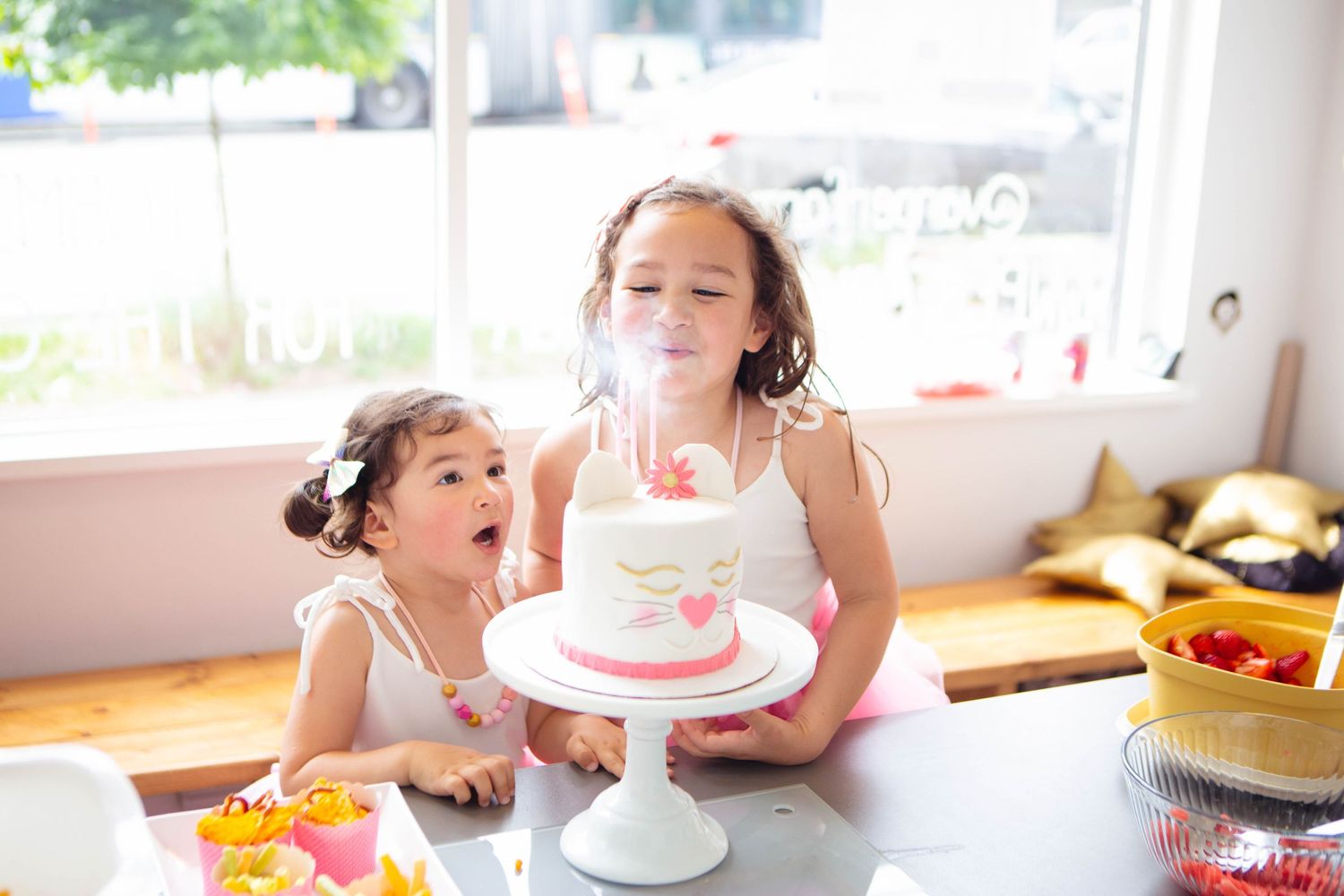 Surrey BC Vancouver Event Photographer mom and daughter birthday party Location Performing Star Blowing out candels